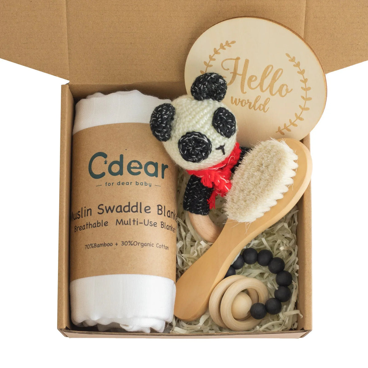 Baby teething toy gift set with bamboo blend gauze blanket, wooden beech bell, teether, brush, and milestone marker.