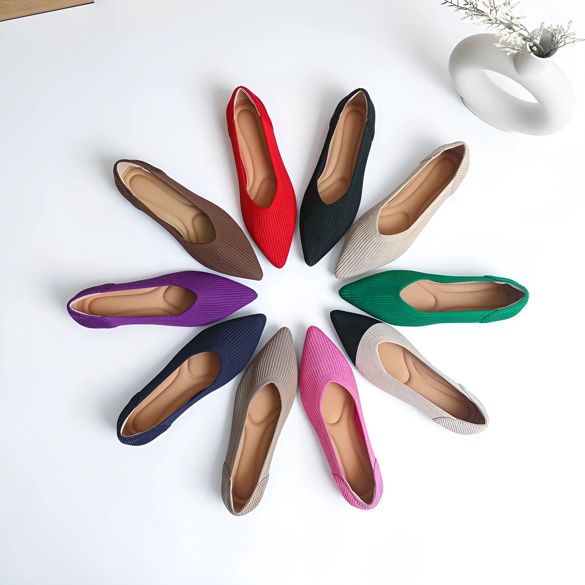 Women's apricot knit flat pump with pointed toe and rubber sole on a white background.