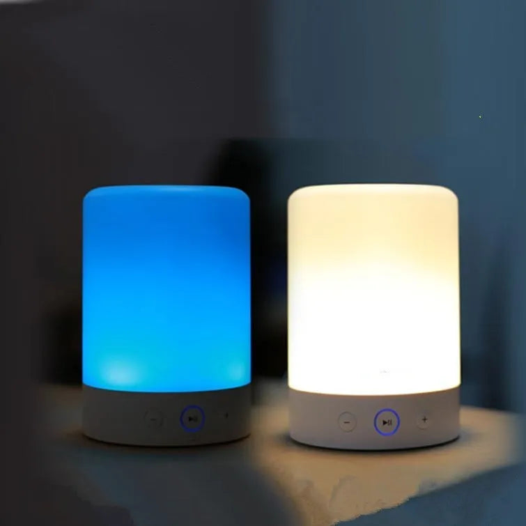 White mini portable Bluetooth sound light speaker with 5W output and touch controls on a surface