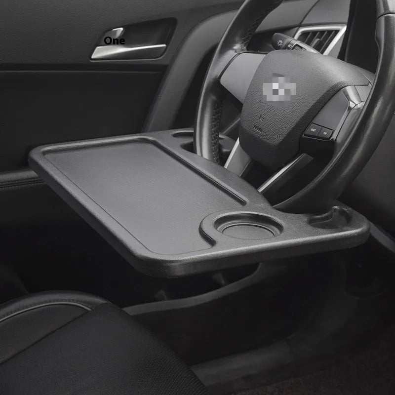 Large black PP steering wheel car desk tray with storage rack, placed over a steering wheel