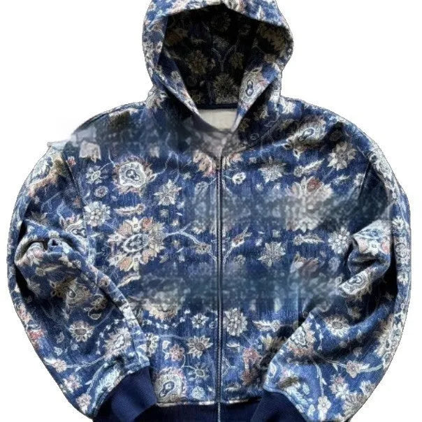 Man wearing a blue loose-fit hooded zip coat with long sleeves and digital printing.