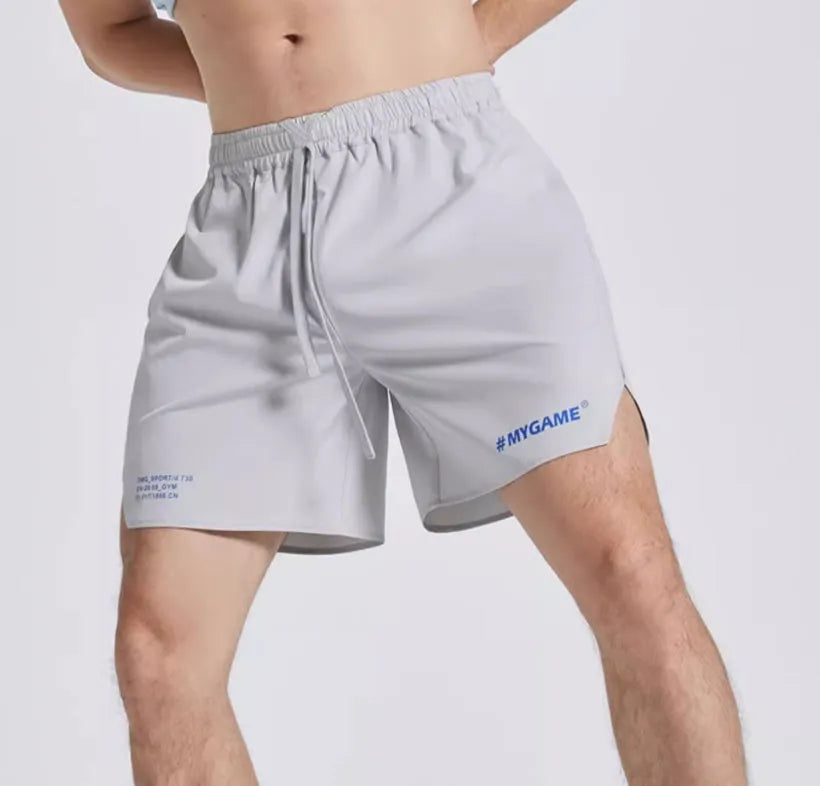 Men's navy blue training fitness shorts made from polyester spandex fabric, shown on a model.