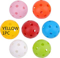 Multi-colour golf practice balls with 26-hole target design on green surface