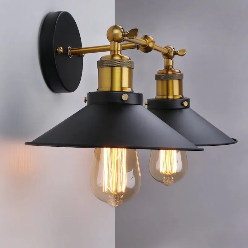 Black double head American retro industrial style iron wall lamp on a dark wall.