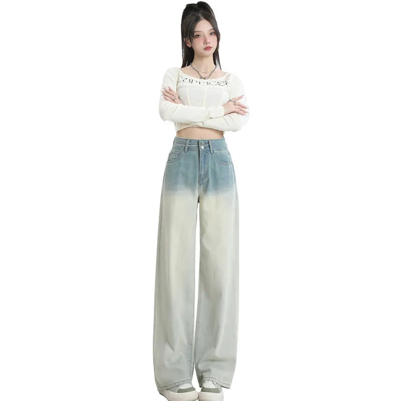 Women's gradient blue straight-leg denim trousers showing colour gradation effect and contemporary cut