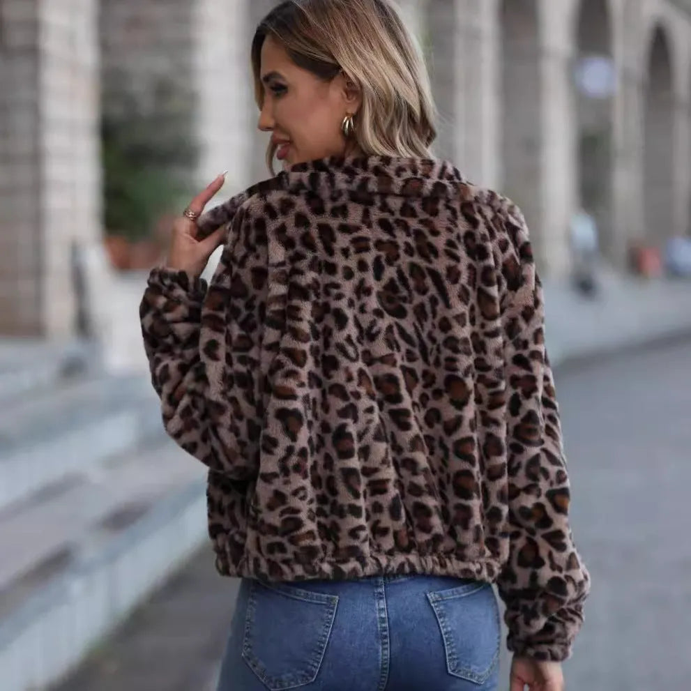 Women's loose long-sleeve leopard print plush coat with a zip front and raglan sleeves.