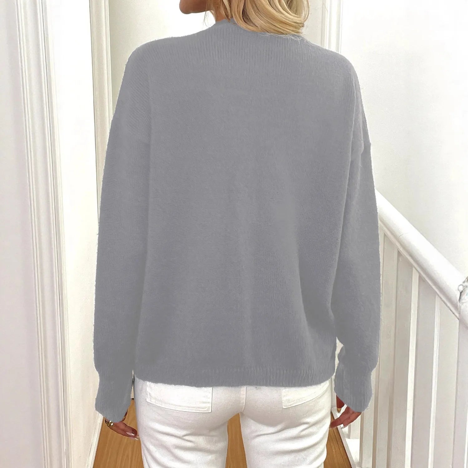 A grey deer plush women's long sleeve sweater coat with princess sleeves, shown in a street hipster style.
