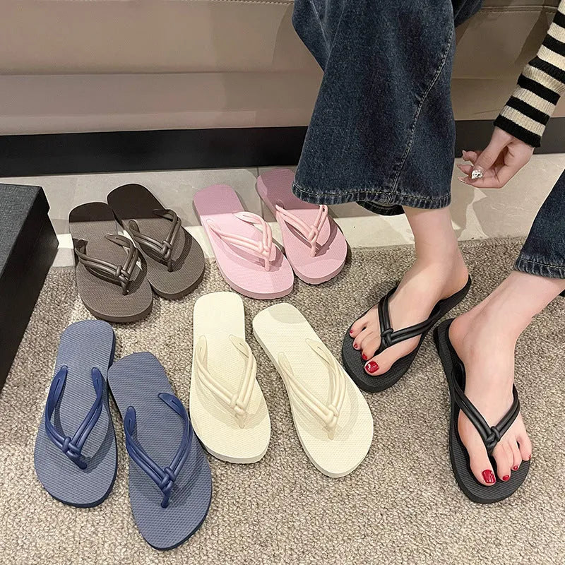PVC toe-covering flip flops for men on a plain background showing colours and injection-moulded sole.