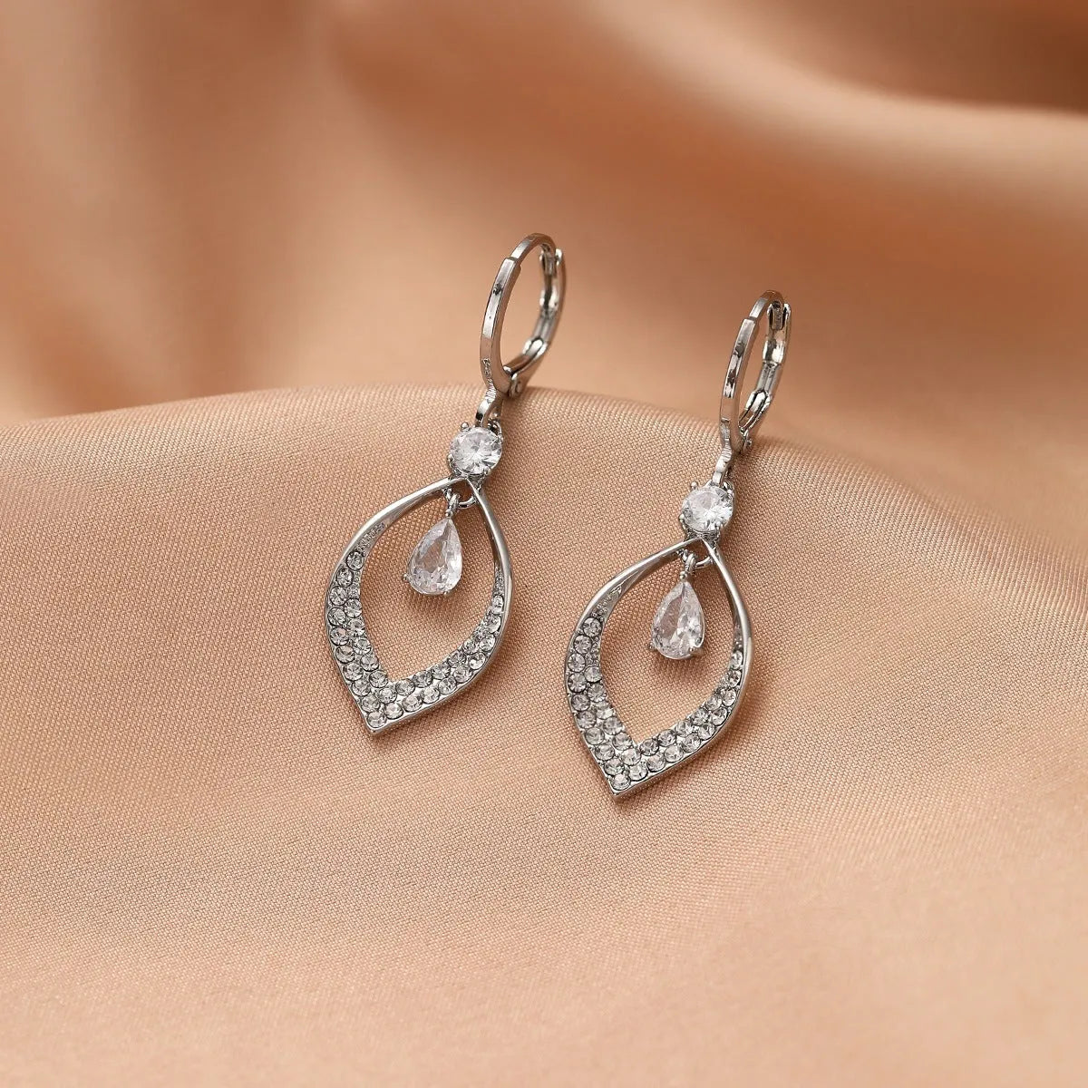 Women's copper zircon water drop earrings with tassels and a choice of gold or silver buckles.