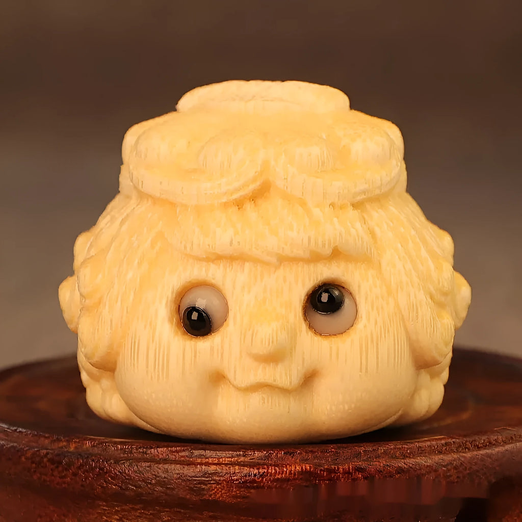 Solid bamboo golden toad princess ornament showing detailed hand carving and natural grain patterns