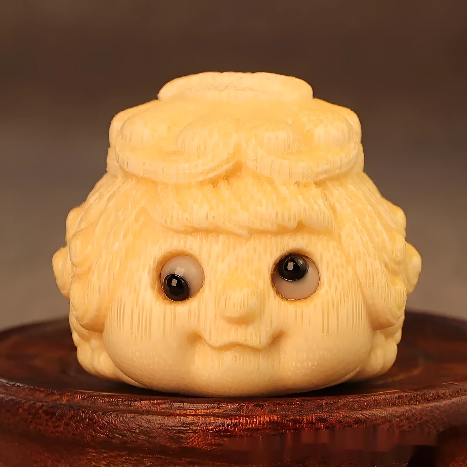 Solid bamboo golden toad princess ornament showing detailed hand carving and natural grain patterns