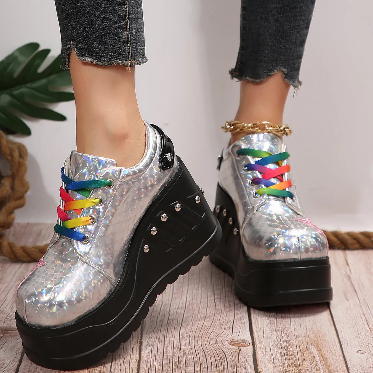 White punk platform shoes with shiny PU upper, rivet detailing, round toe, and thick sole