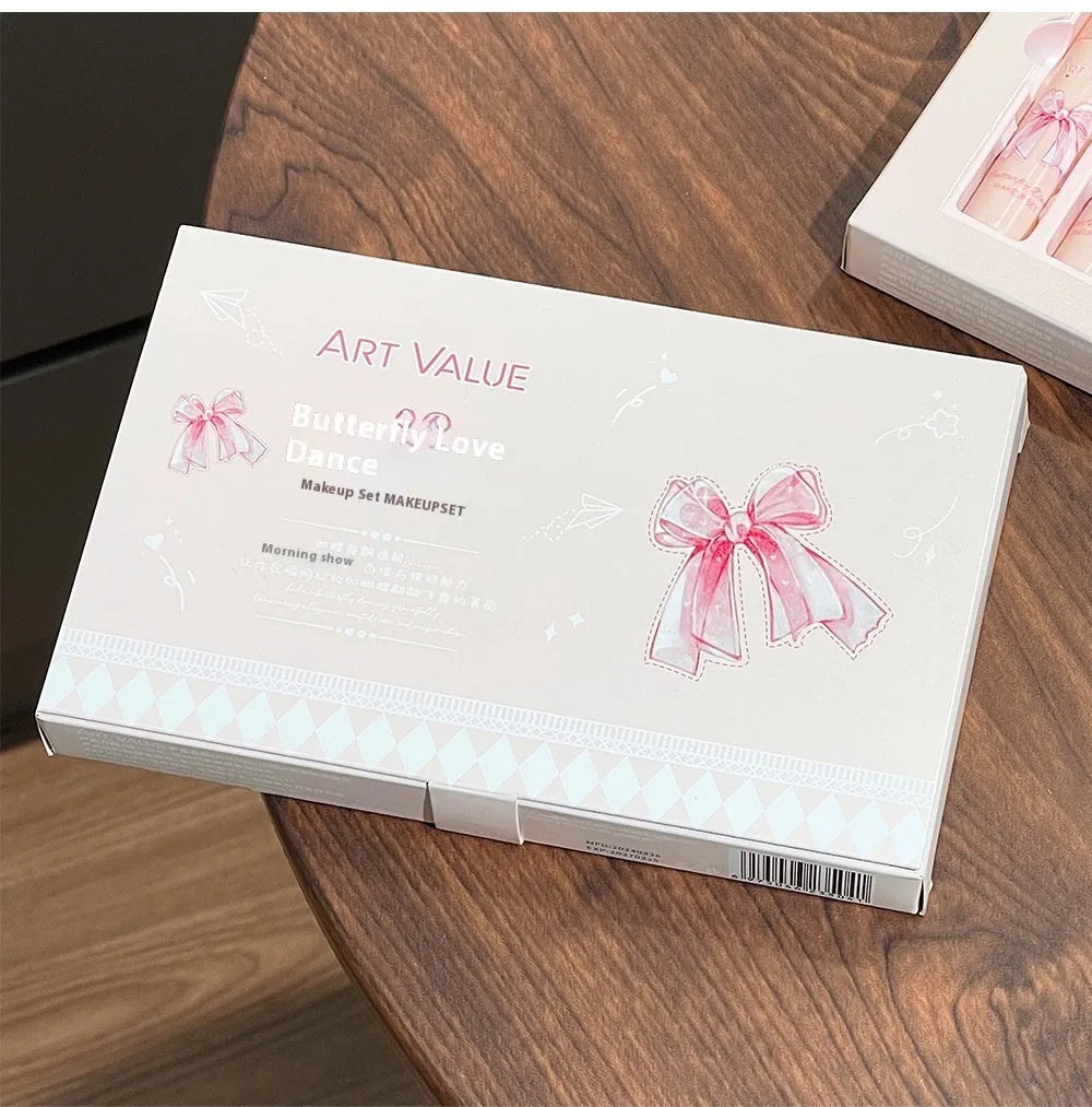 Pink butterfly box suite makeup set with lip muds, blusher, and necklace.