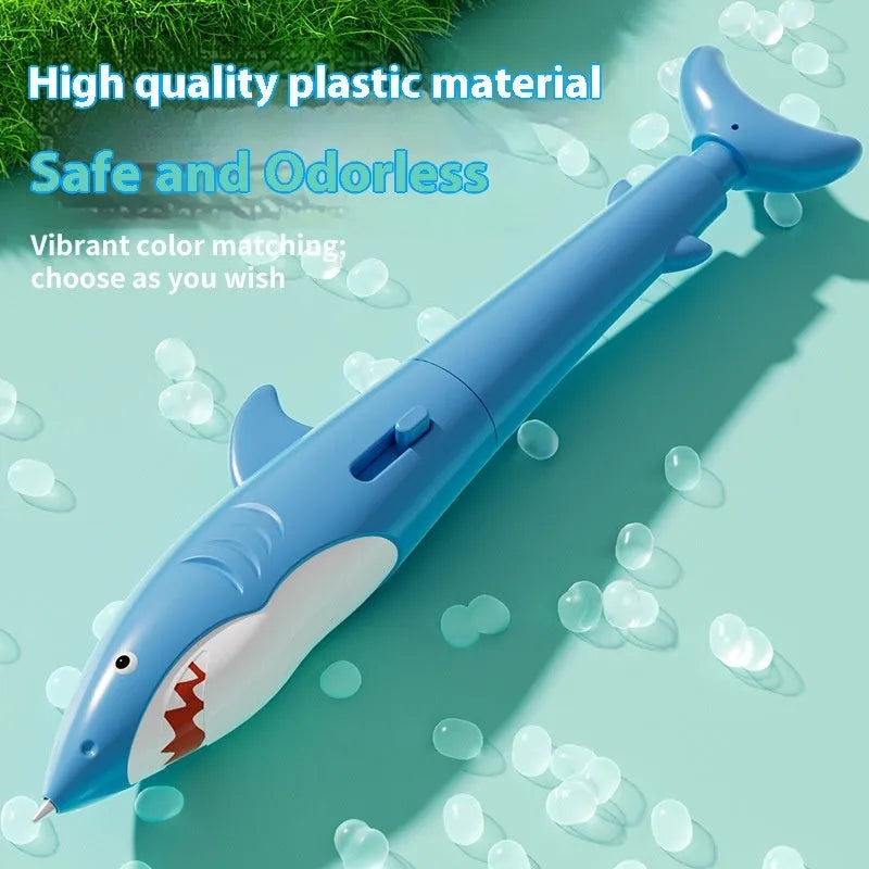 Shark water gun pen in blue plastic with press mechanism for water spray, on white background