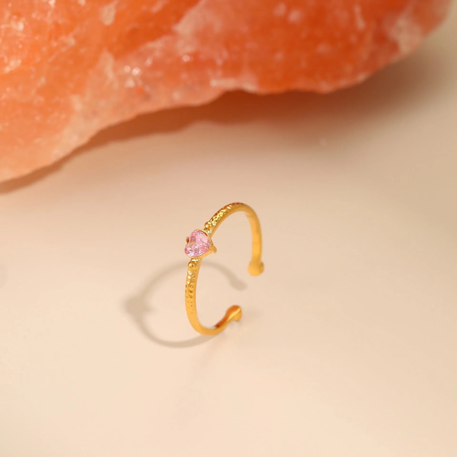 Open-ended stainless steel heart-shaped ring with inlaid zircon stones in green, pink, or white.