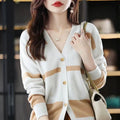 Women's black and white striped knitted cardigan with 3D pattern and V-neck.