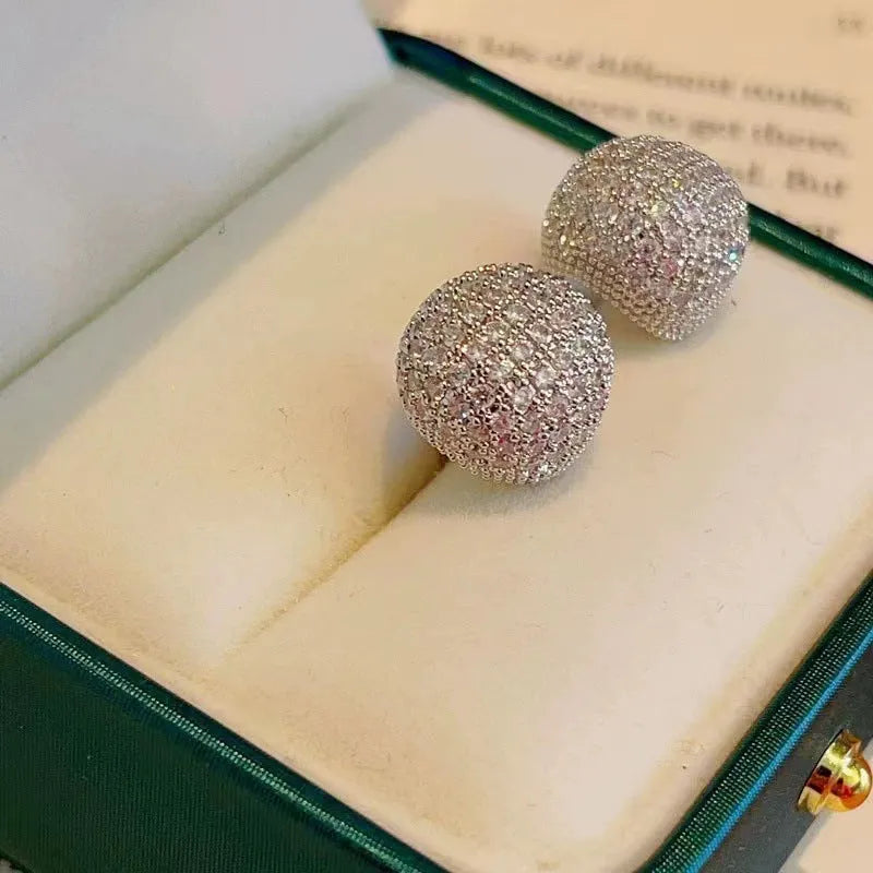 Women's gold and white drop-shaped ear clip earrings with full diamond embellishment and geometric golden beans design