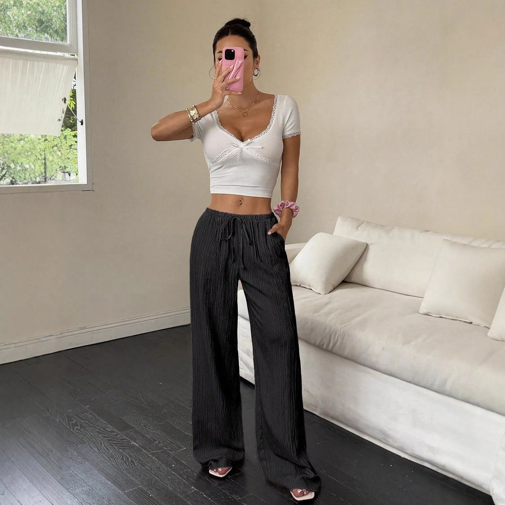 Women's wide leg trousers with lace-up waist trimming in polyester fabric