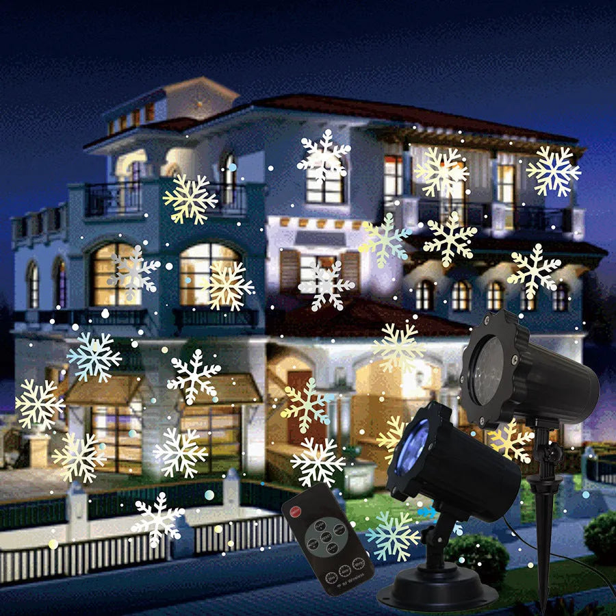 LED Christmas snowflake laser light projector IP65 waterproof with white snowflakes projecting onto a garden wall at night