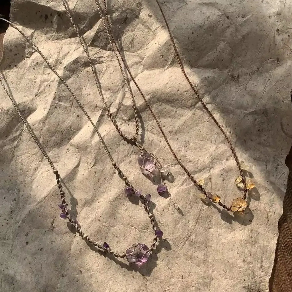 Artificial crystal rough labradorite-style pendant necklace with O-link chain on display
