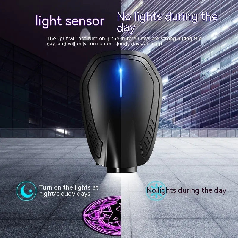 Black F2 USB rechargeable car welcome light projecting illuminated image on ground.