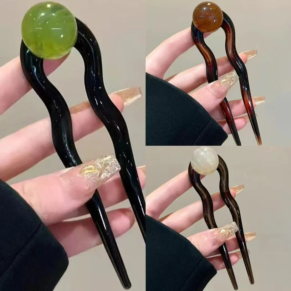 Acrylic U-shaped hair barrette with a small spherical decoration in a beige and caramel two-tone colour combination.