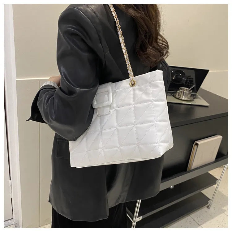 Women's soft PU shoulder bag with chain strap in trapezoid shape, black colour option
