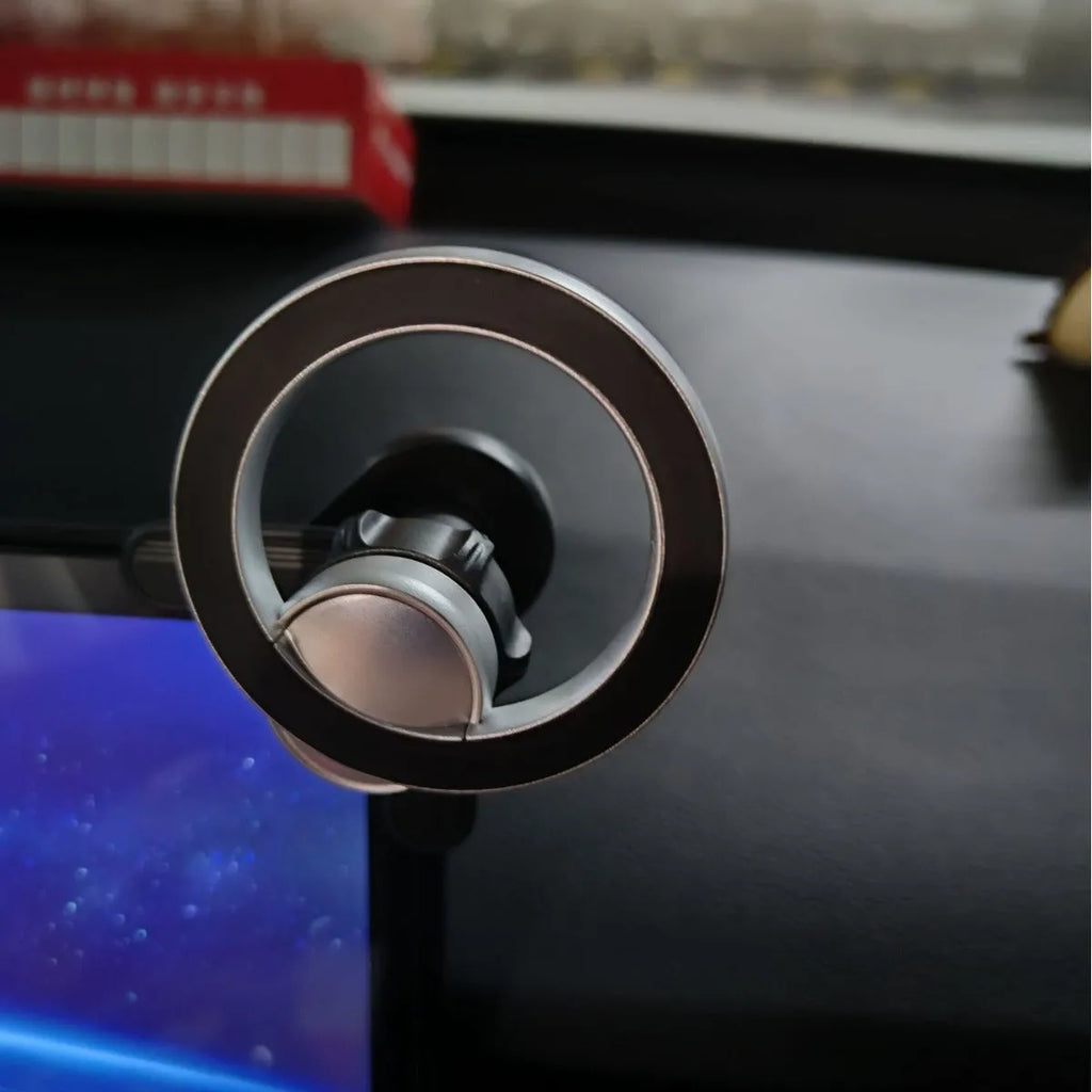 Black plastic magnetic ring phone holder attached to vehicle display screen with universal base and ring magnet