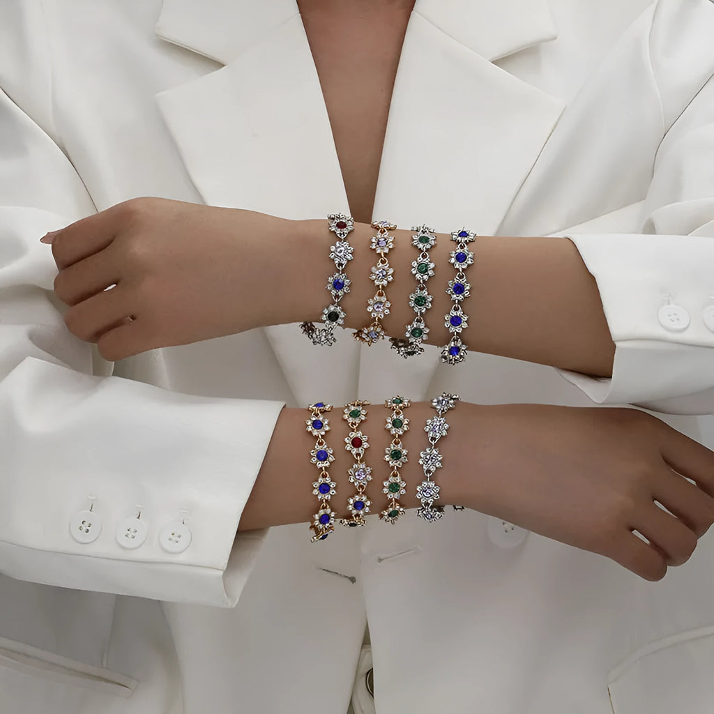 Electroplated zinc alloy floral bracelet showing colour variations including gold and silver tone options