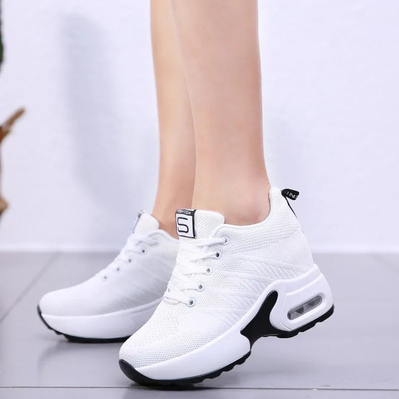 Women's lightweight casual travel shoes in white with fabric upper and round toe