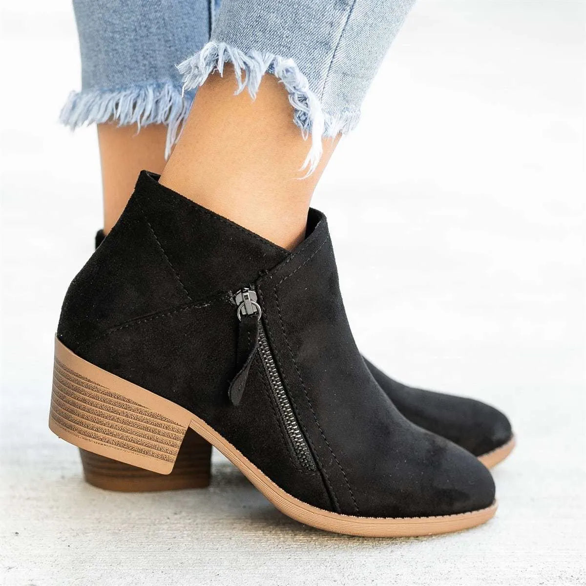 Women’s suede leather ankle boots with side zipper, thick heel, pointed toe, and non-slip sole in beige colour