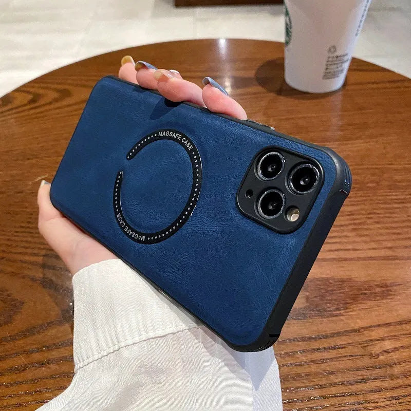 Black imitation leather magnetic charging case for Apple iPhone on a table.