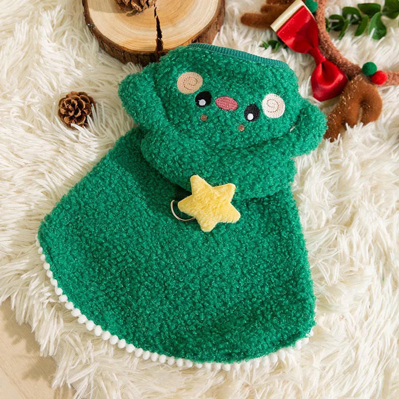 Green granular velvet Christmas pet cape with tree-shaped hat and star on a small dog