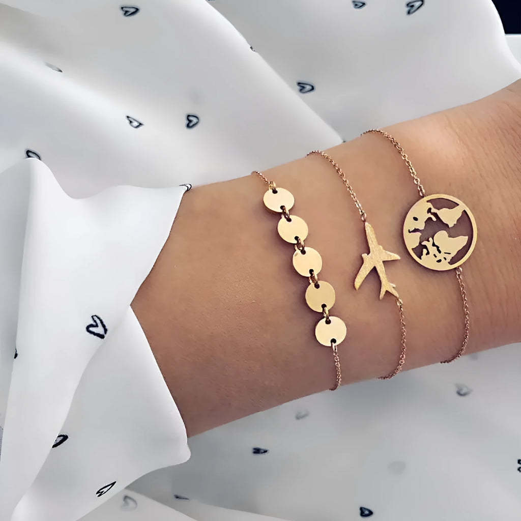Set of three women's bohemian-style bracelets with alloy heart charms featuring detailed aircraft map designs.