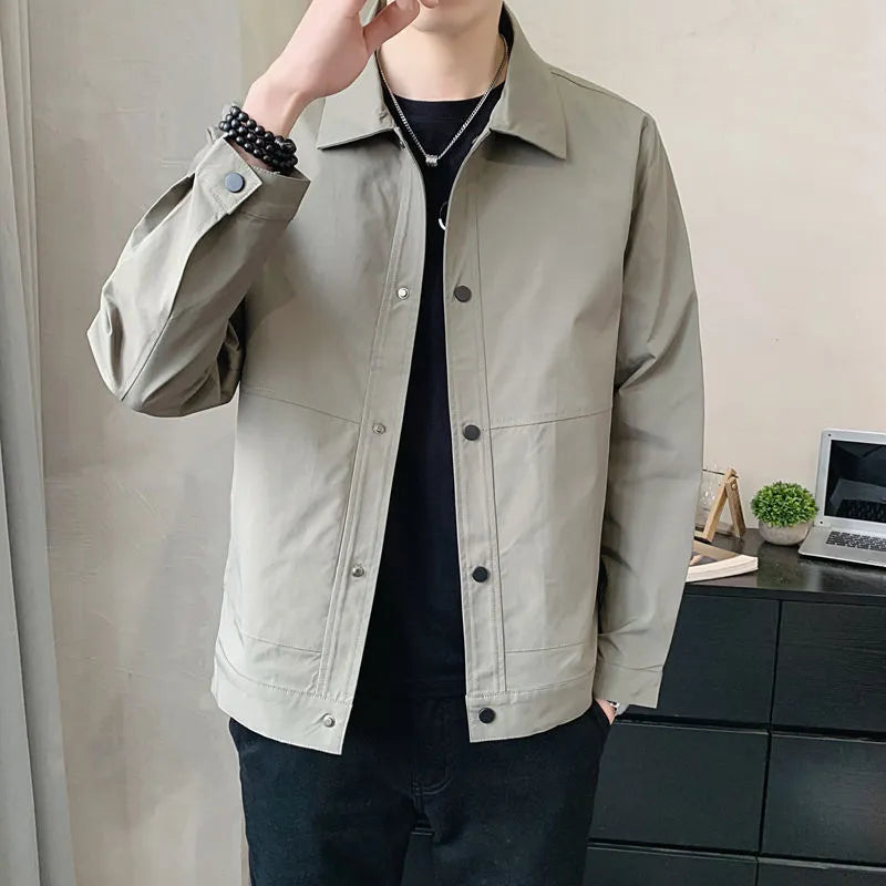 Man wearing a lightweight grey single-layer Korean-style jacket for spring or autumn.
