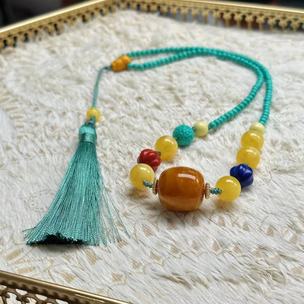 Turquoise mesh flower lucky pendant necklace with adjustable ball bead chain, hand-woven design detail shown