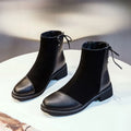 Black women's knee-high Martin boots with side zip, round toe, decorative bow, and rubber sole.