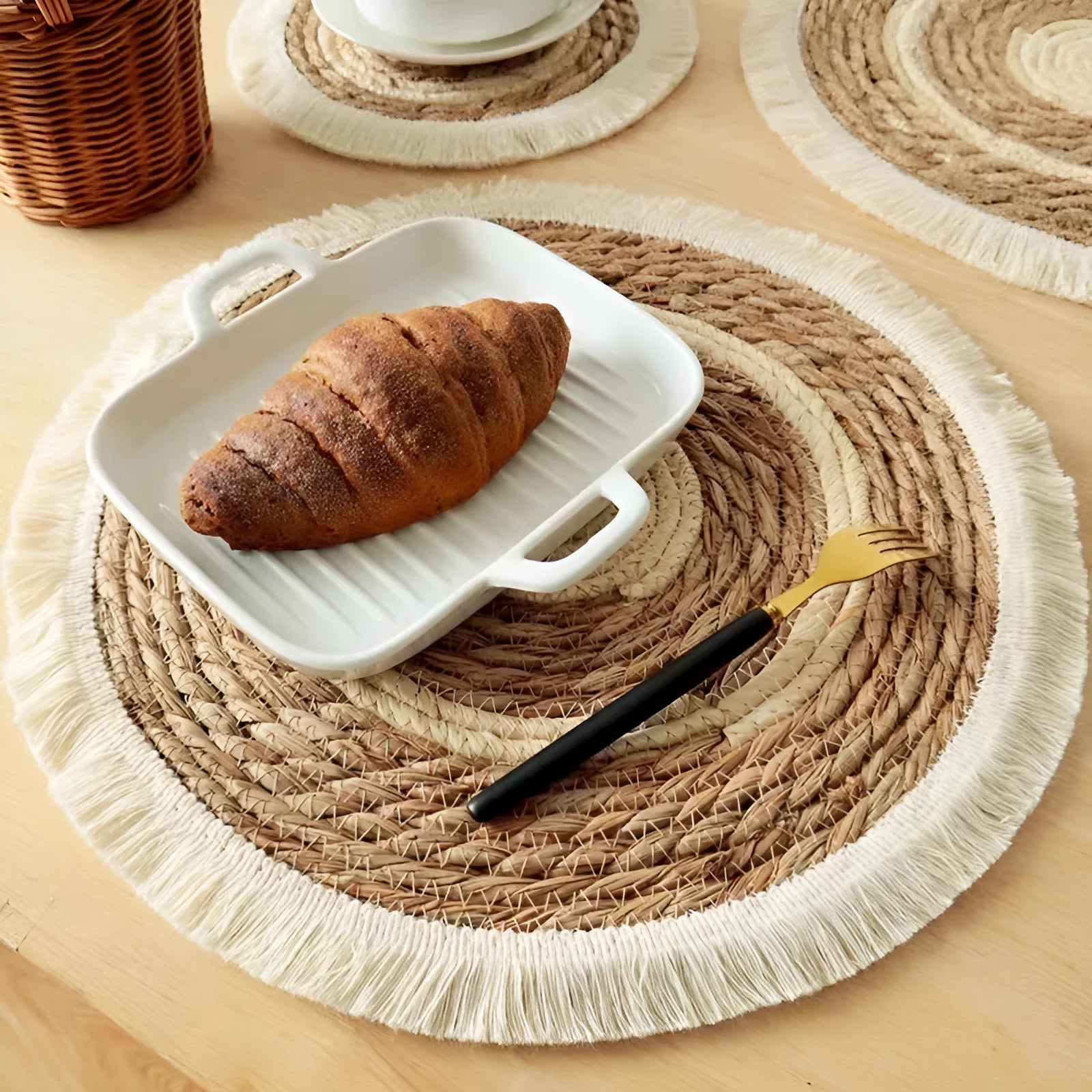 Round Japanese-style papyrus placemat with decorative tassels in natural colour
