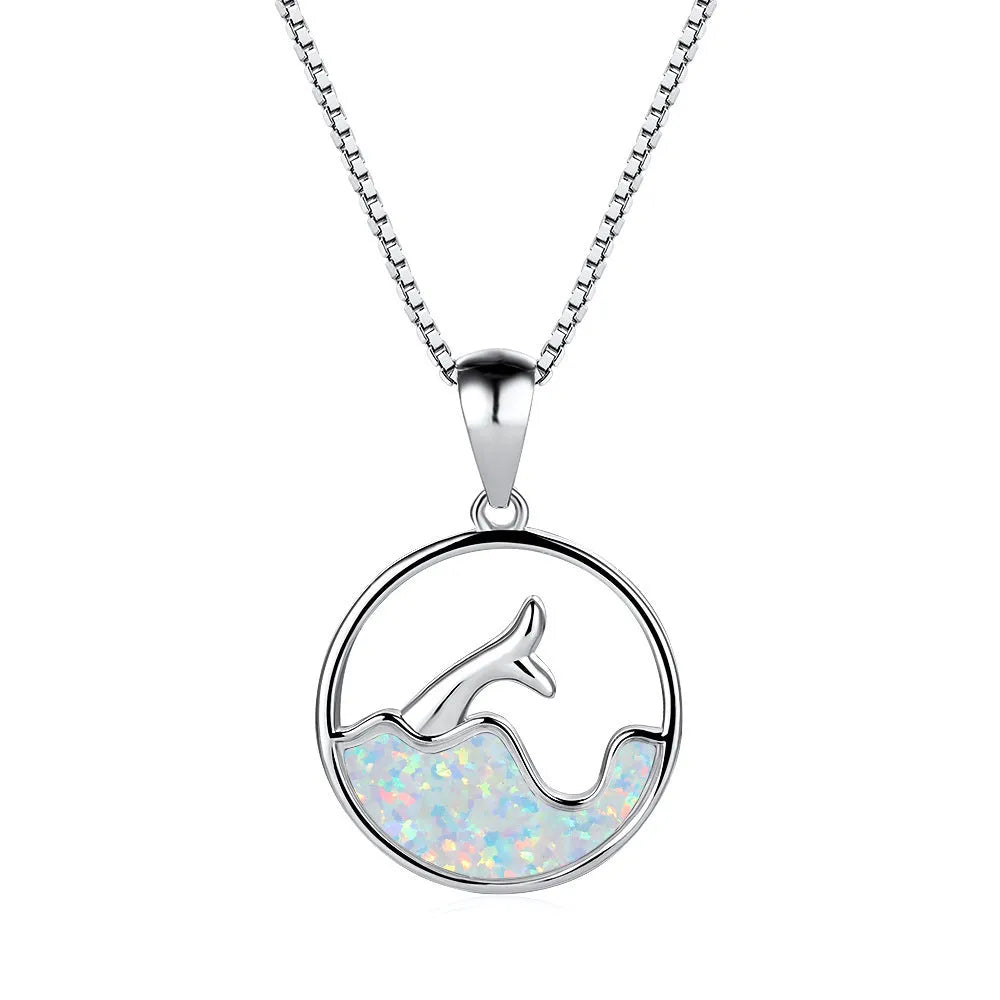 Geometric sea fishtail pendant necklace with a round blue opal and white gold electroplated finish.