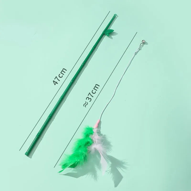 Green interactive cat feather wand toy with bells and feathers for indoor play and training