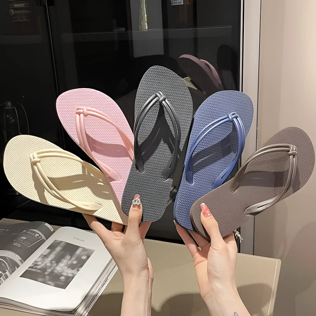 PVC toe-covering flip flops for men on a plain background showing colours and injection-moulded sole.