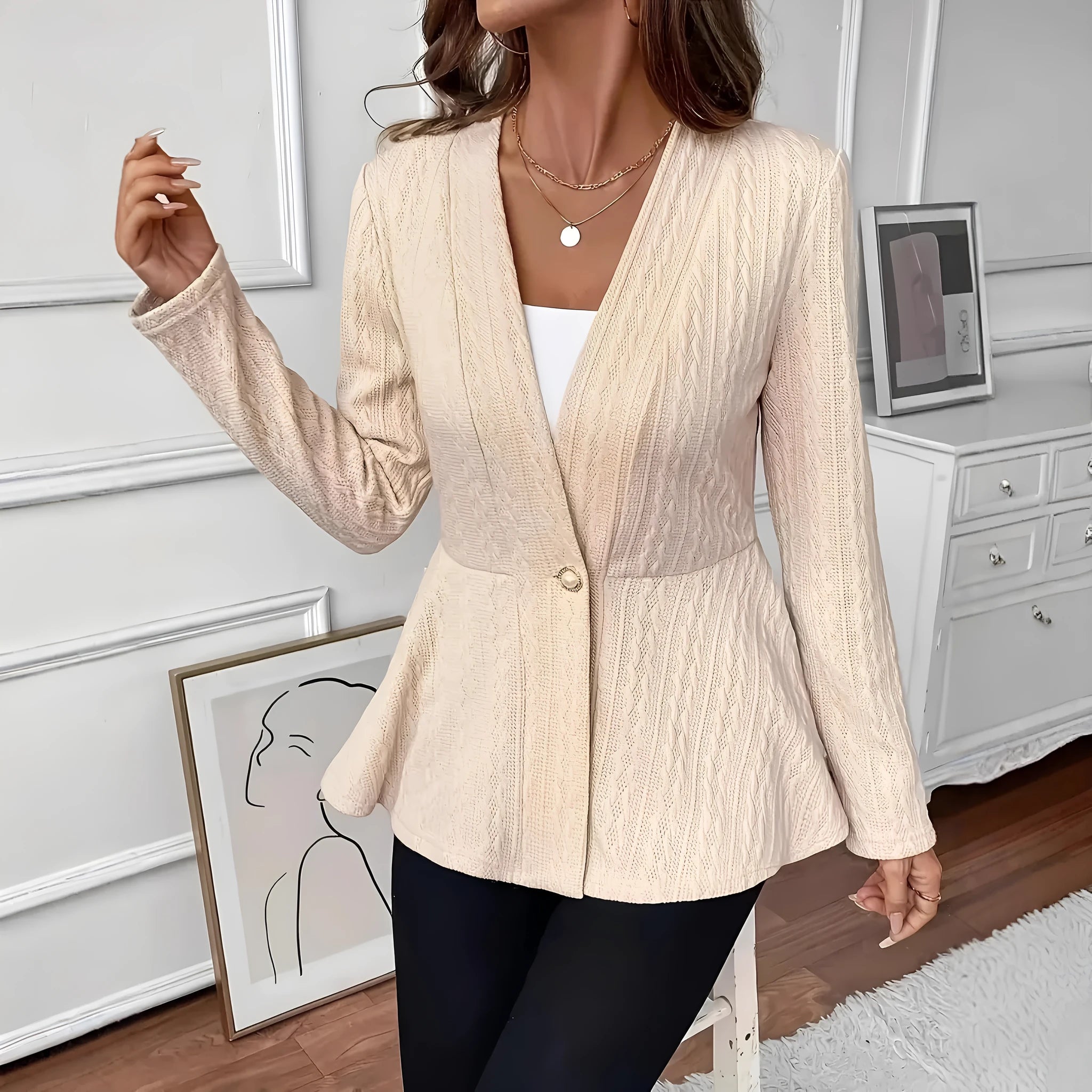 Women's apricot knitted cardigan with jacquard pattern and one-button closure showing front view