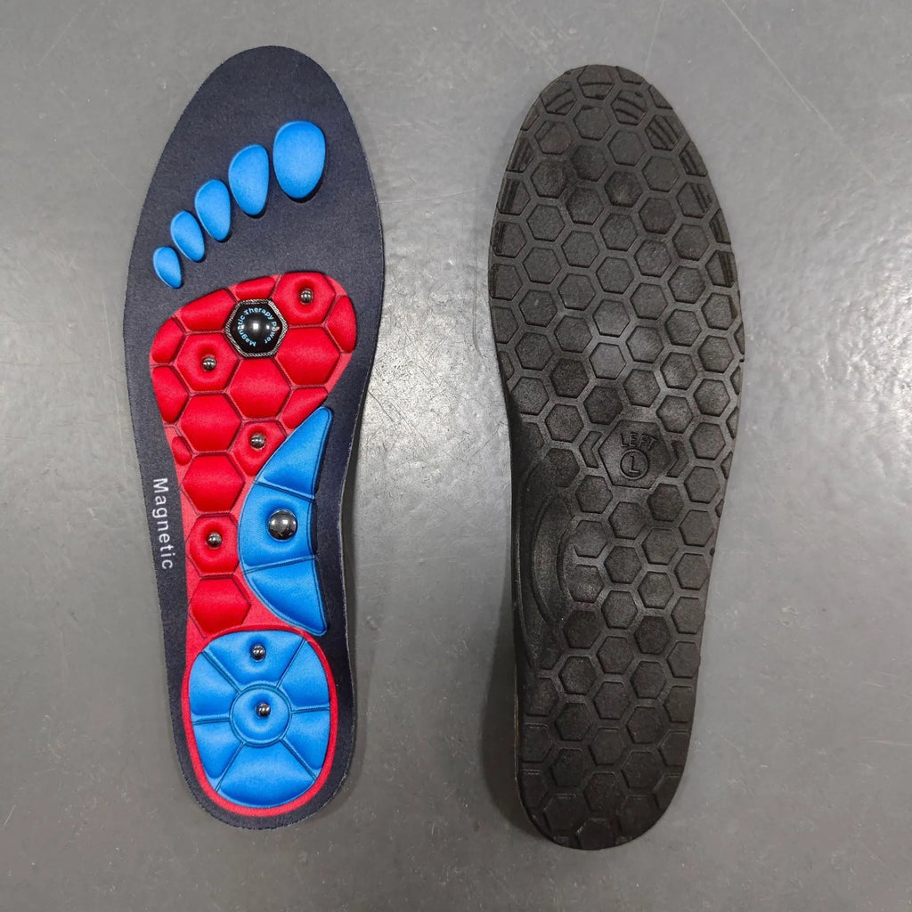 Black magnetic EVA insoles with gel massage nodes on a neutral background
