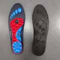 Black magnetic EVA insoles with gel massage nodes on a neutral background