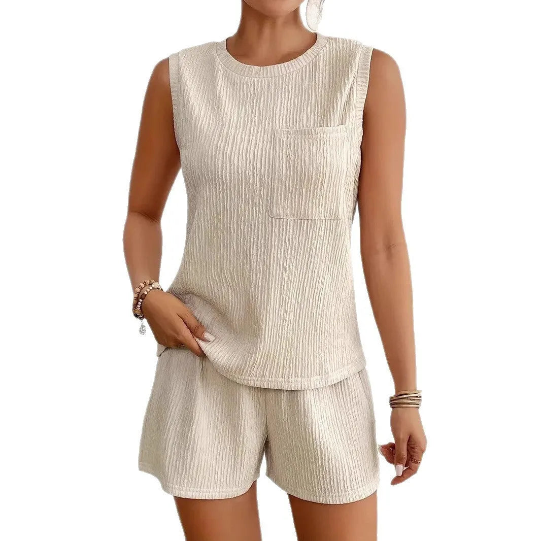 Women's apricot polyester sleeveless vest and matching shorts set on a hanger.