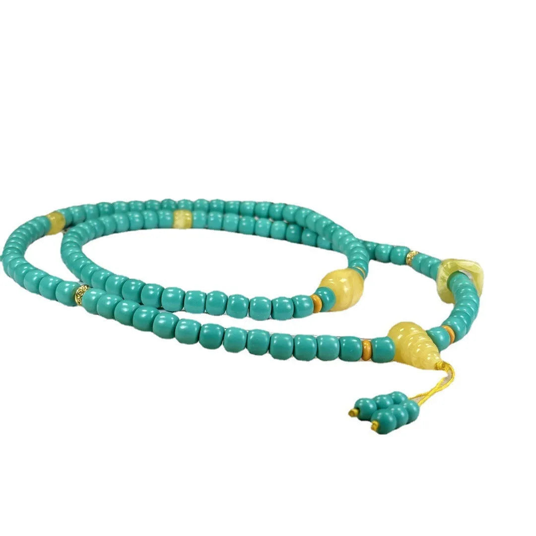 Turquoise mesh flower lucky pendant necklace with adjustable ball bead chain, hand-woven design detail shown