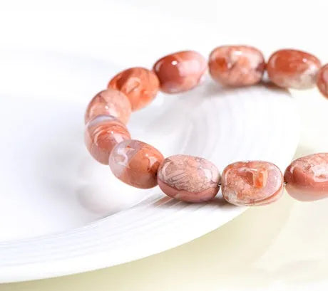 Natural cherry agate barrel bead bracelet with geometric 10x14mm beads and ruyi design
