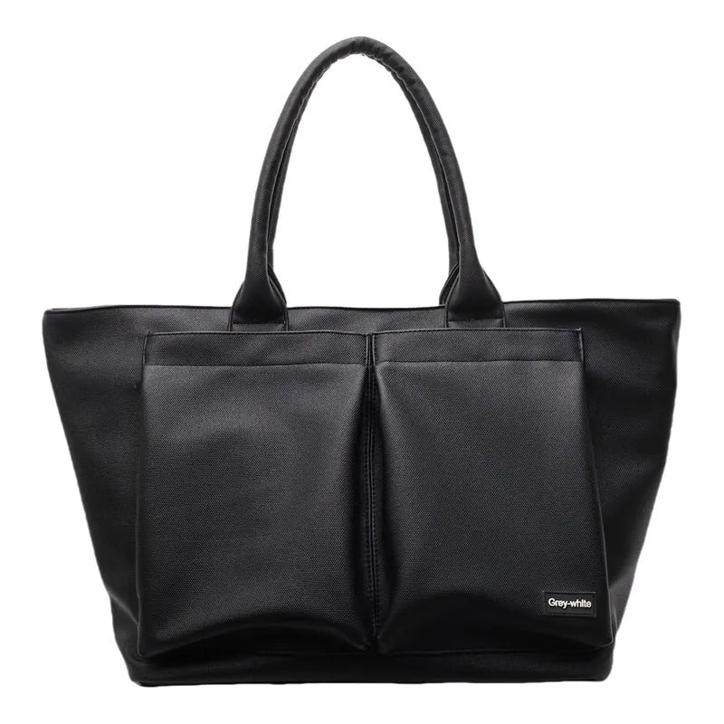 Lightweight expandable PU shoulder bag in black, shown with adjustable strap and sporty design.