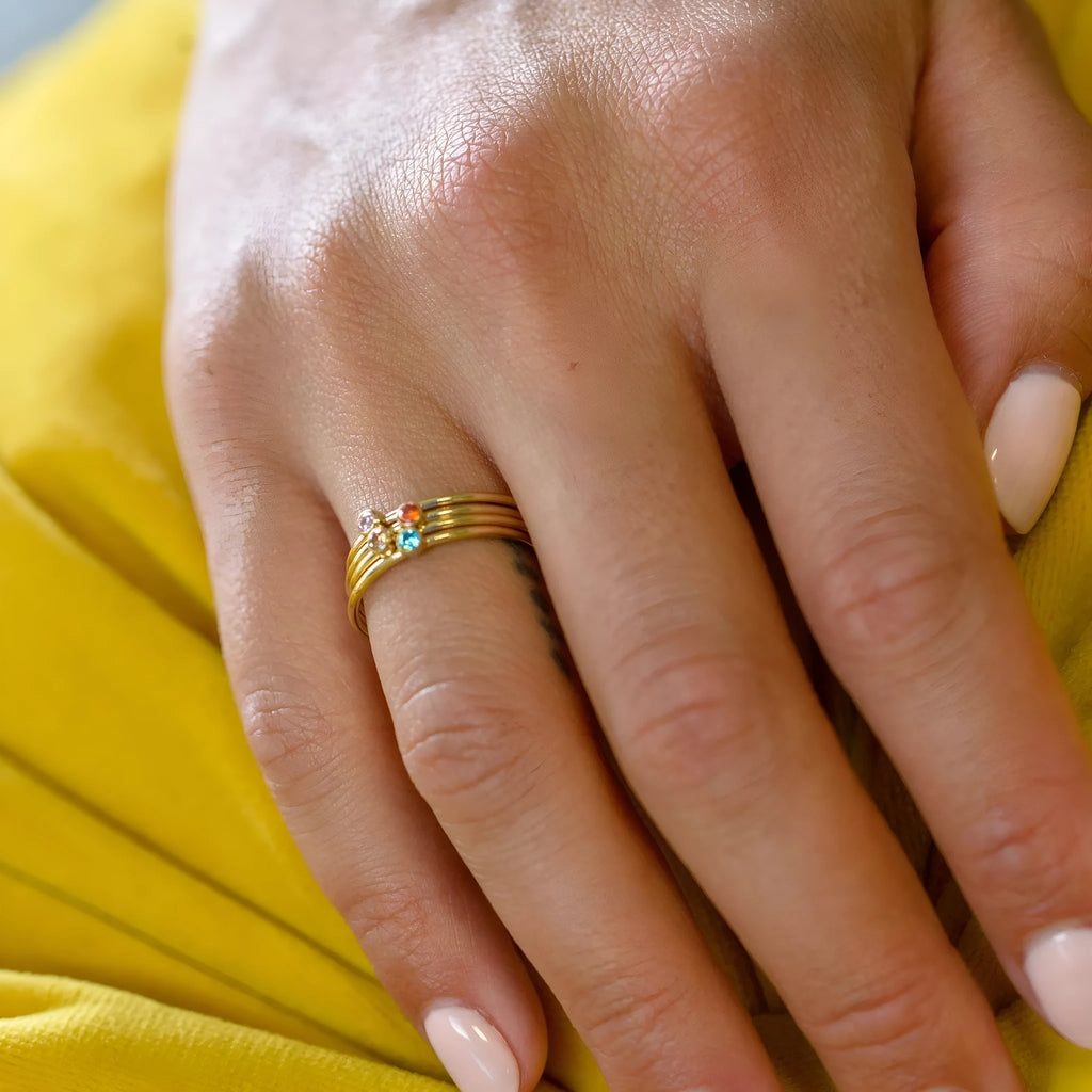 December birthstone engraved titanium steel ring with gold electroplating on geometric band.