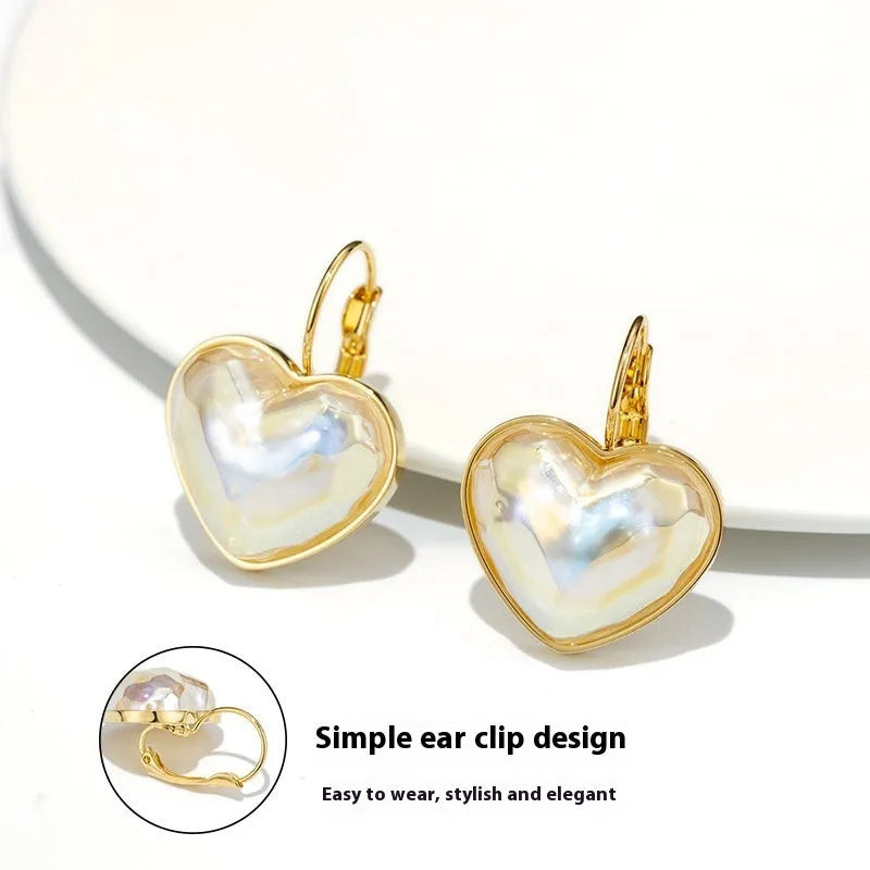 Pair of gold-coloured alloy clip-on earrings with a fashion niche design for women.